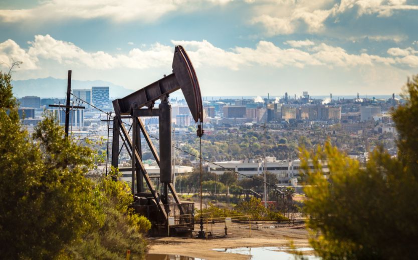 Image of pumpjack extracting fossil fuels near Los Angeles, California neighborhood