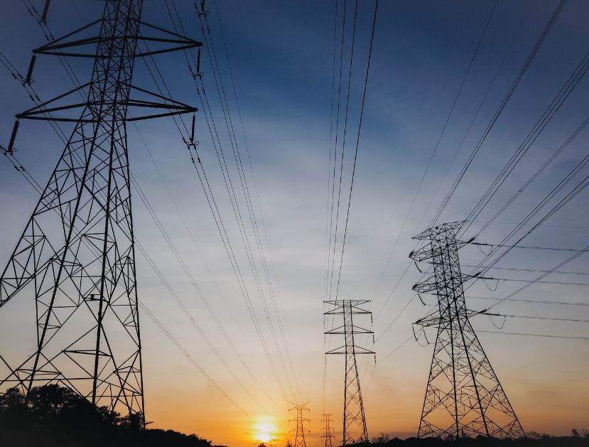 Three powerlines during sunrise