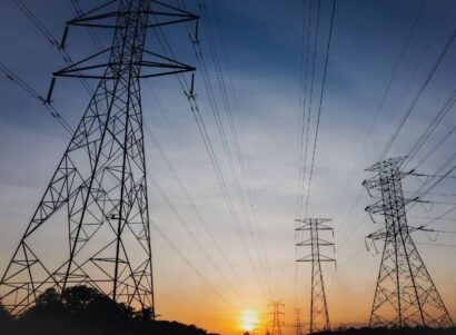 Three powerlines during a sunset