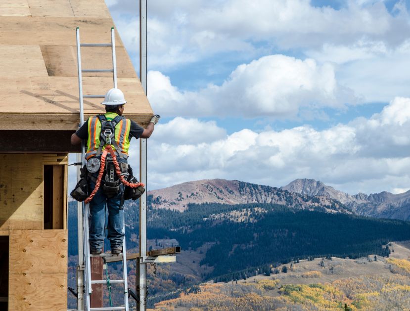 Image of construction working building a home