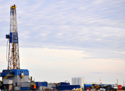 fracking rig during the day being installed into land